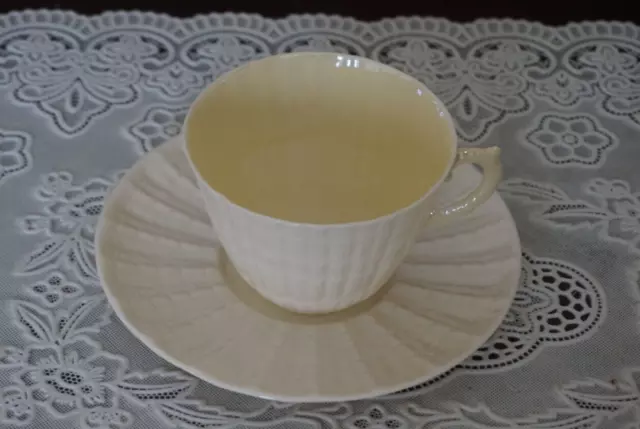 VINTAGE Belleek Limpet Shape Yellow Luster Tea Cup and Saucer, Ireland