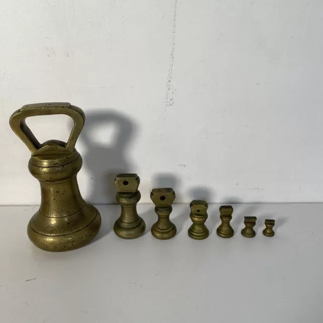 Set of 7 Brass Bell Shaped Scale Weights: 1 lb 8oz 4oz 2oz 1oz 1/2oz 1/4oz