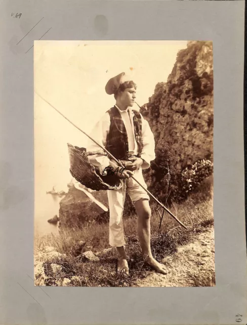 Albuminabzug Wilhelm von Gloeden No. M 0067  Young fisherman with pipe