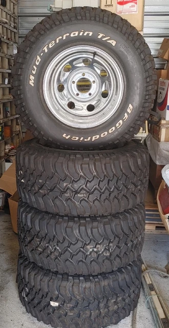 4 New Mud-Terrain T/A BF Goodrich LT 325/60 R15 KM+ American Racing Rims.