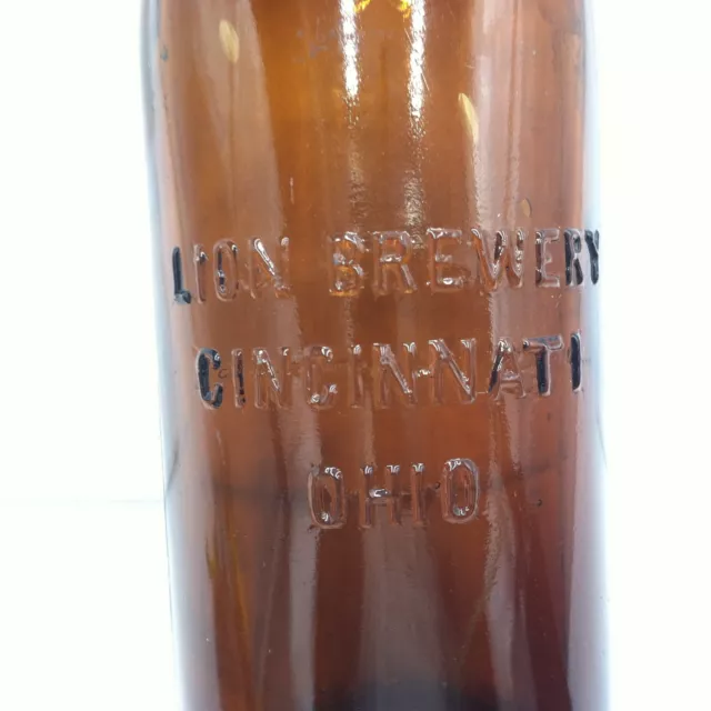 The Lion Brewing Company Cincinnati, OH amber embossed blob top beer bottle