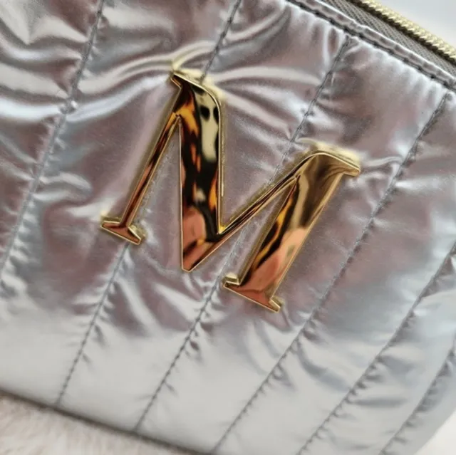 NWT gold "M" make up travel bag in silver with FREE reusable plastic bottle.