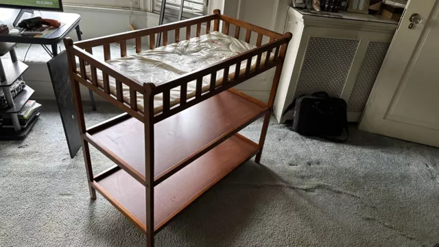 Baby changing table with shelves