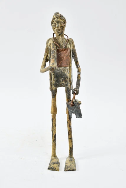 L70M12 - Figura de diferentes metales, hombre con equipaje