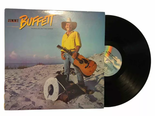 LP de Jimmy Buffett Riddles In The Sand. Discos MCA. MCA-5512. 1984 casi nuevo