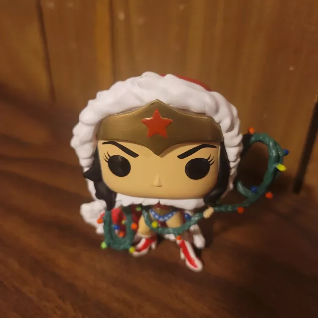 Funko Pop! DC Super Heroes Wonder Woman 354 with string light lasso in protector