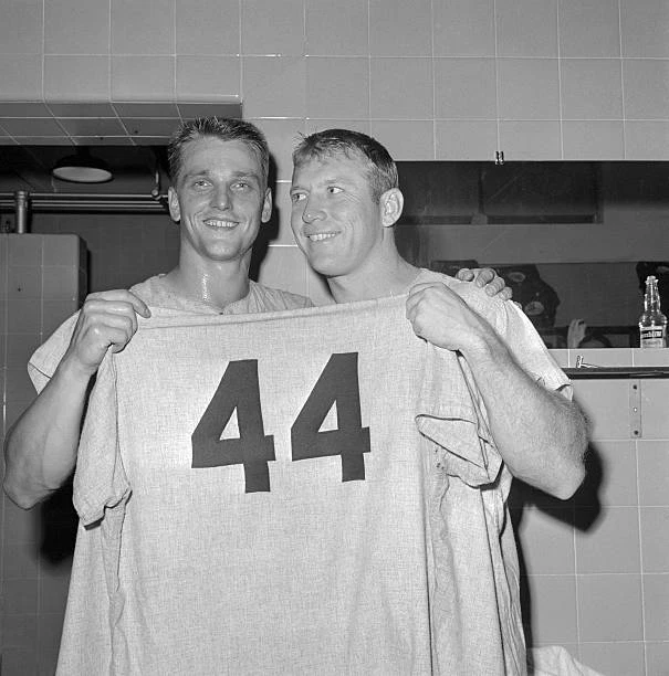 NEW YORK YANKEES sluggers Roger Maris Mickey Mantle hold up a 1961