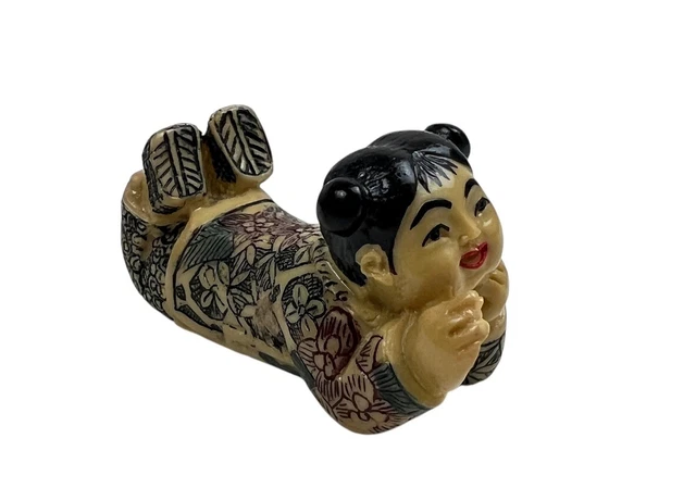 Lot 170 - AN IVORY SHUNGA NETSUKE OF ONNA DARUMA