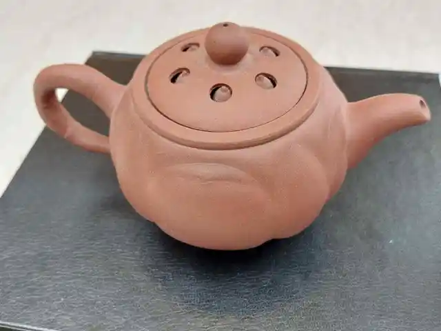 Old Chinese Yixing teapot with four cups