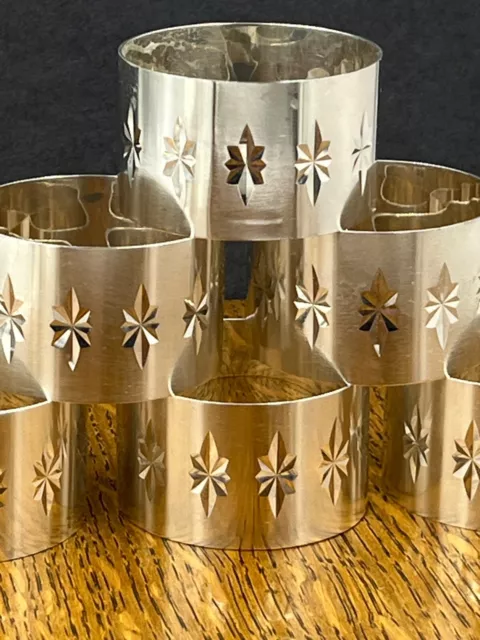 A set of six modernist star burst sterling silver napkin rings Birmingham 1971