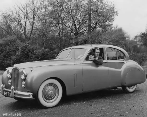 Alan Ladd driving his Jaguar Mark VII saloon car near his home - 1955 Old Photo