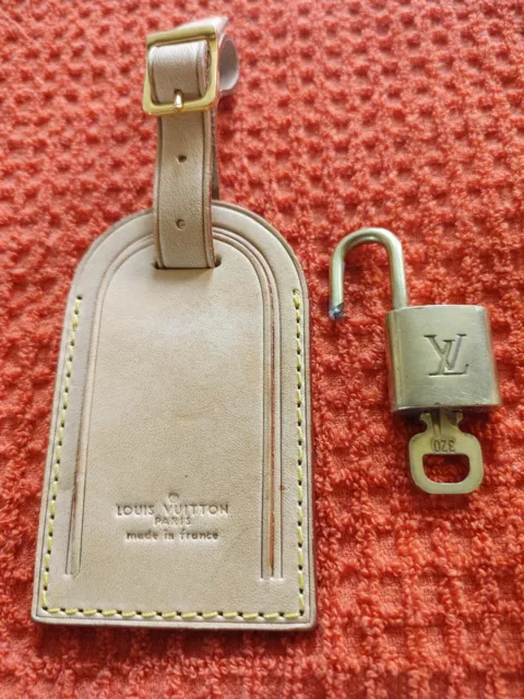 Louis Vuitton luggage tag with Hawaii flower heat stamped in gold on ebene  and in fuchsia on vachetta