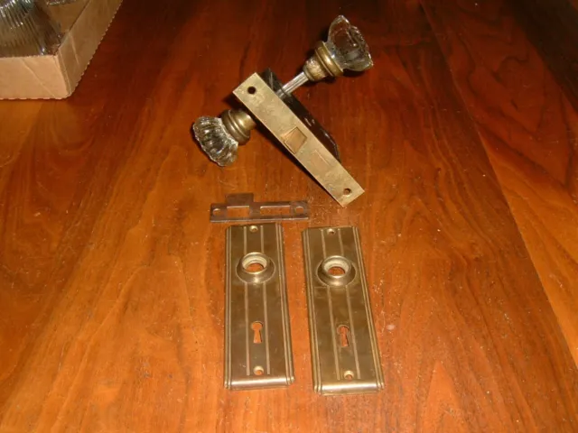 Old door lock with two 12 point clear door knobs & 2 Art Deco back plates