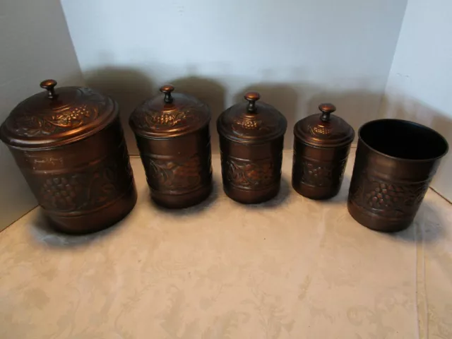Vtg Metal Old Dutch Heritage 9 Piece set Embossed Copper tone canisters