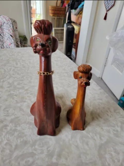 Vintage long neck wooden poodles with jewel eyes.             made in Hong Kong