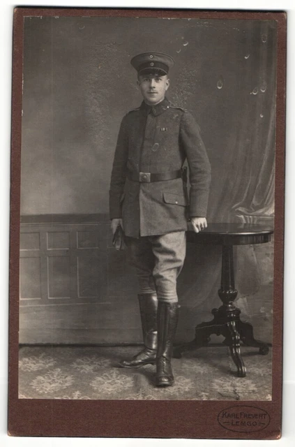 Photography Karl Frevert, Lemgo, portrait soldier in uniform with umbrella hat