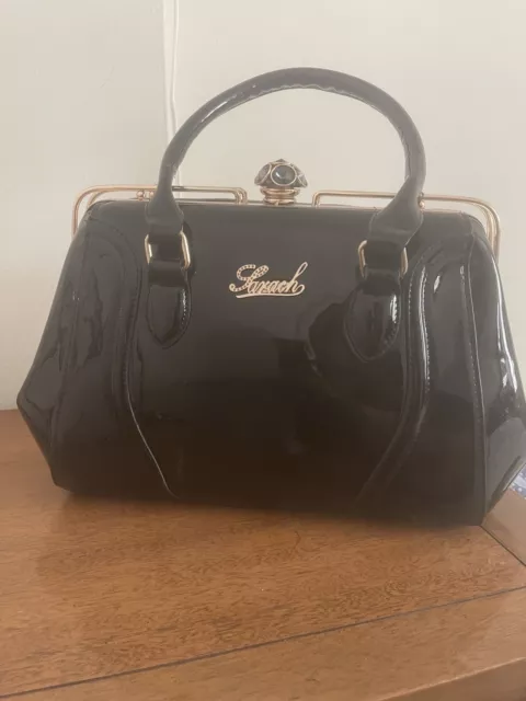 Black Big Size Purse Beautiful And Shining From Outside