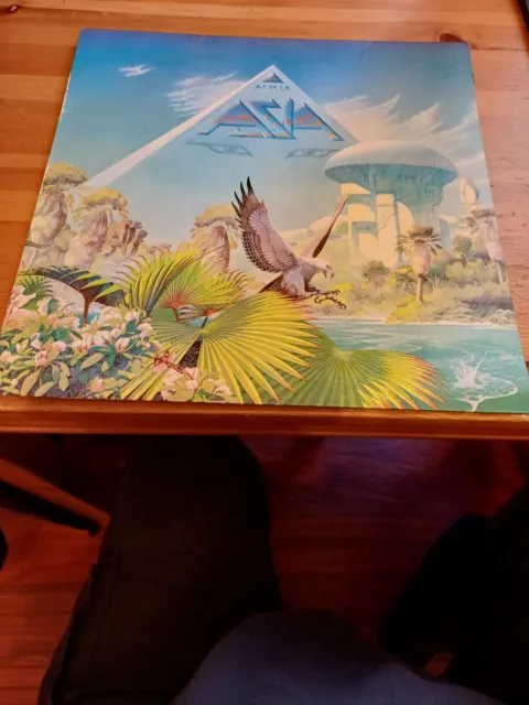 We Have Here A Very Nice 12" Viynl LP Album Record Which Is Called Alpha By Asia