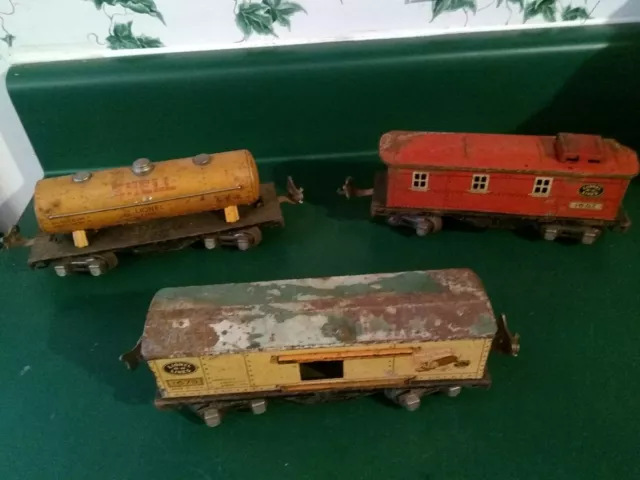Lionel Pre War 1679 Baby Ruth Box Car, 1660 Shell Tanker and 1682 Caboose