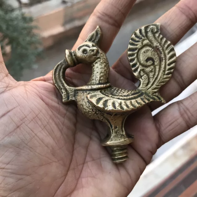 An antique or old Finial, bird shape solid brass