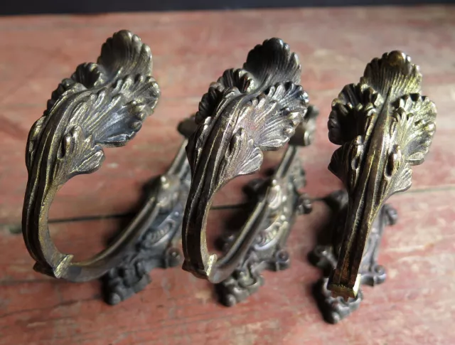THREE 19th CENTURY GILT BRASS CURTAIN TIE BACKS