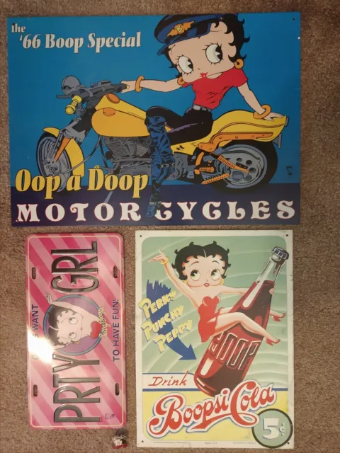 3 Betty Boop Metal Advertising Signs and 1 Pin