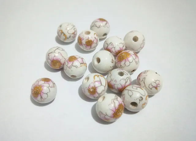 10pz perline ceramica tondo fiore 12mm colore bianco, oro bijoux