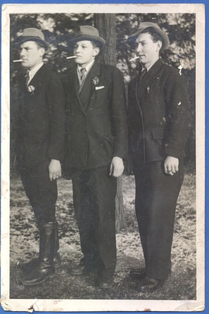 Three handsome guys in hats smoking cigarettes Vintage photo