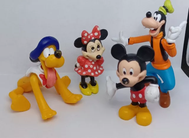 4 Disney Figures Mickey, Minnie, Goofy, And Pluto