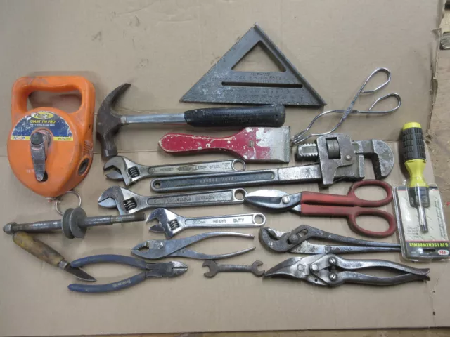 lot of hand tools speed sq chalk line16" pipe wrench pliers snips screwdriver