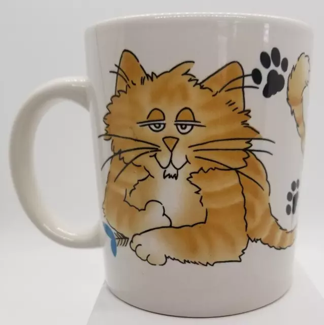 Vintage Tabby Cat Relaxing Holding Blue Flower White Mug