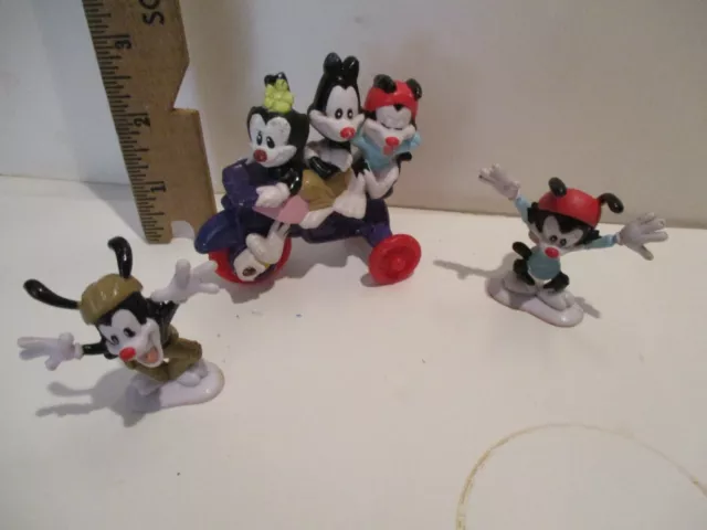 Three [3] "Animaniacs" Action Figures.