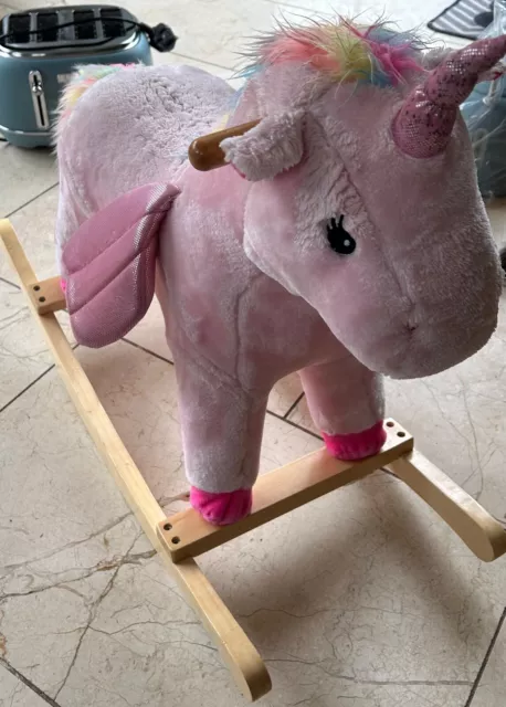 Pink Unicorn Sit on Rocking Horse