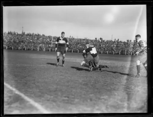 Rugby union players tackling in a West versus East game, NSW, 10 S- Old Photo