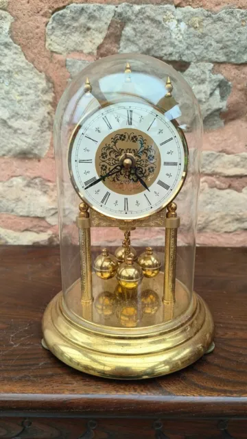 Vintage west German quartz Torsion clock 1980 Under glass dome Battery Powered