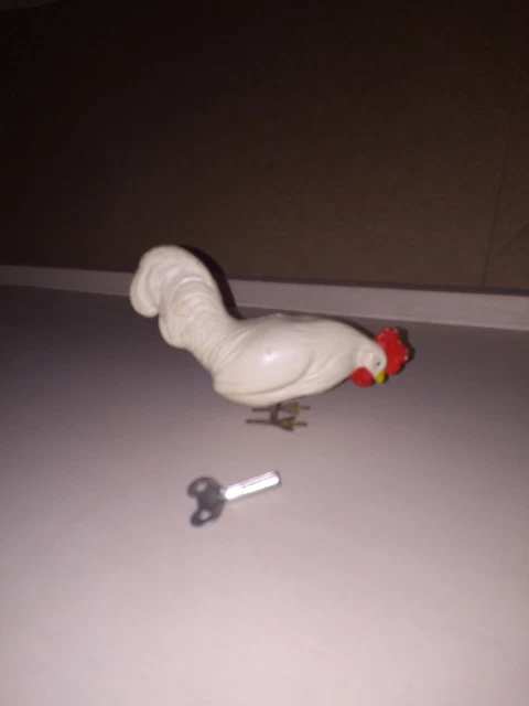 Jouet mécanique poulet picore en tôle avec sa boite Jouet mécanique poulet picore en tôle avec sa boite