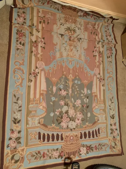 Antique floral and pastel patterned rug