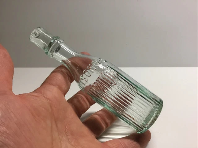 Round Antique Poisonous Embossed Burst Top Poison Bottle.