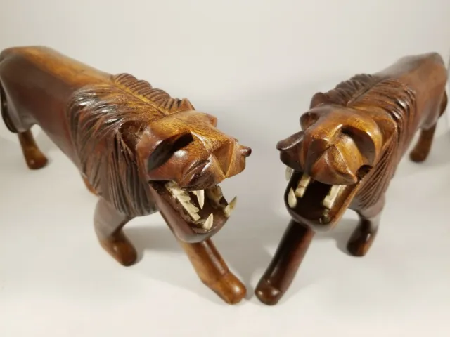 Pair of Vintage Tribal Lion Sculpture Solid Wood Hand Carved.  Symmetrical.