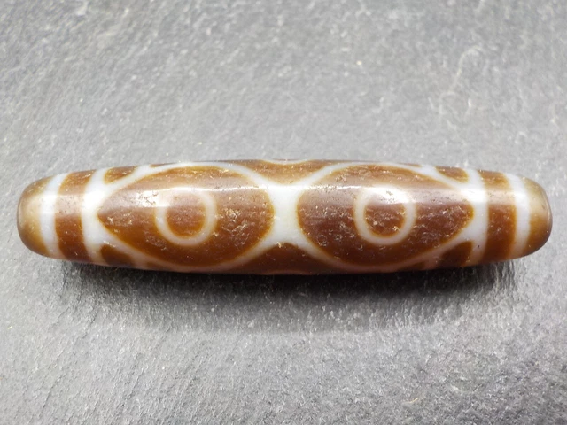 An Agate Dzi bead with a 6 Eye pattern from Tibet / Nepal.