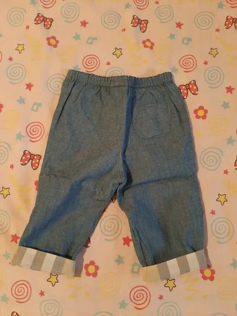 Bambina, jeans Burberry reversibili e camicia Monnalisa 2 anni