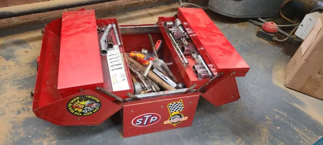 Vintage metal tool chest with car related stickers
