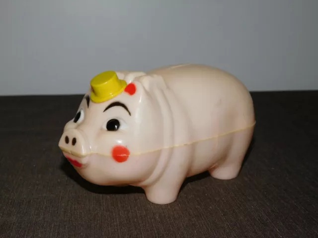 VINTAGE MONEY 6 1/2" LONG PLASTIC PIGGY PIG with RAISING TOP HAT COIN BANK