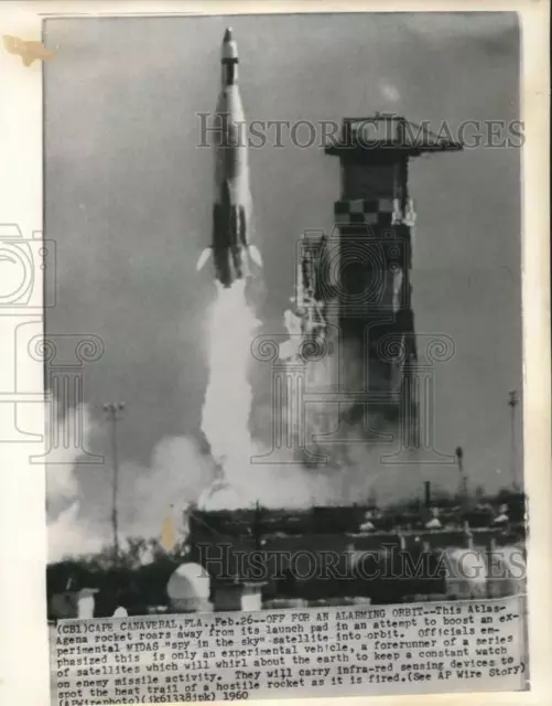 1960 Press Photo An Atlas-Agena rocket roars from its launch pad, Cape Canaveral