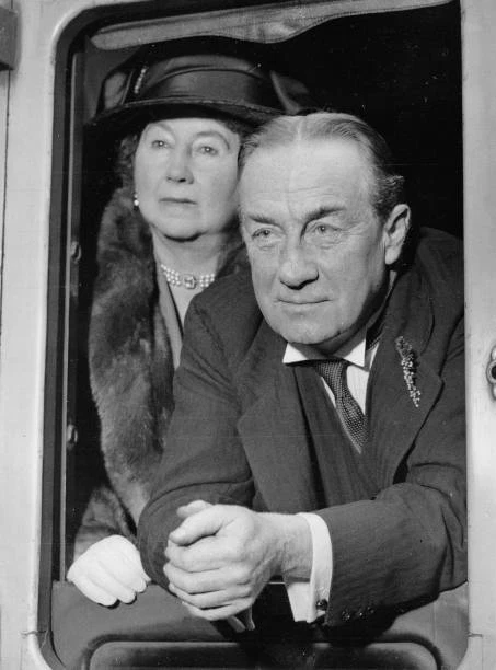 BRITISH POLITICIAN STANLEY Baldwin with his wife on departure at P- Old ...