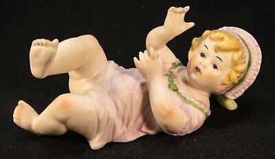 Vintage 8.5” Porcelain Bisque Girl Laying on Back Piano Baby