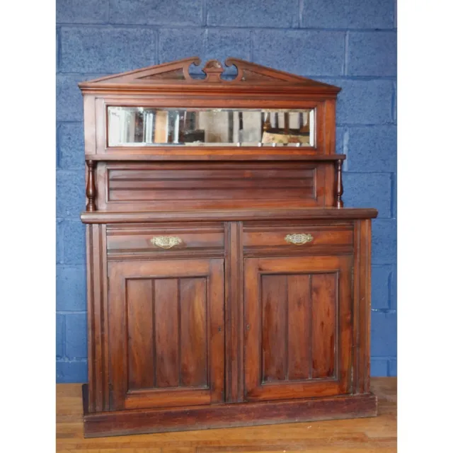 A Victorian Carved Walnut Chiffonier or Sideboard with Mirrored Back