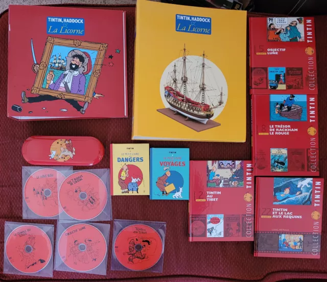 Lot Tintin - 5 DVD, 4 livres sur BD, 2 classeurs, 2 mini livres et un plumier