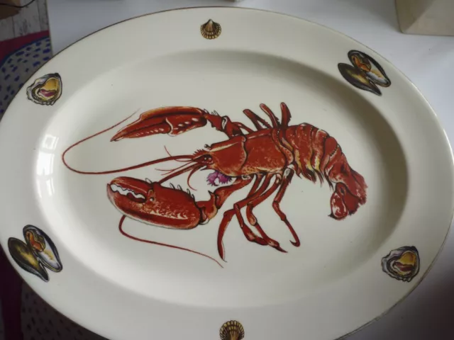 Large oval platter plate, lobster, cockle, oyster, mussel pictures on rim