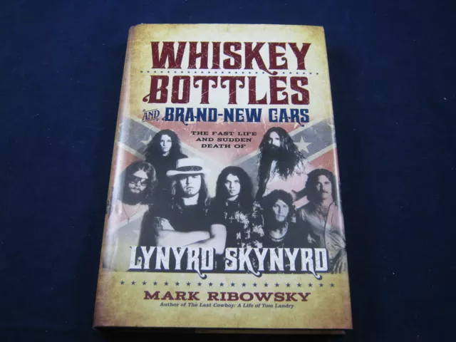 lynyrd skynyrd whiskey bottles and brand new cars